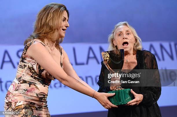 Actress Elena Cotta accepts Coppa Volpi for Best Actress for 'Via Castellana Bandiera' from Jury member Martina Gedeck on stage during the Closing...