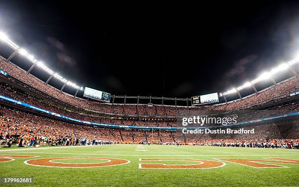 General view of the field and the stands full of fans wearing orange jerseys during the game between the Denver Broncos and the Baltimore Ravens at...