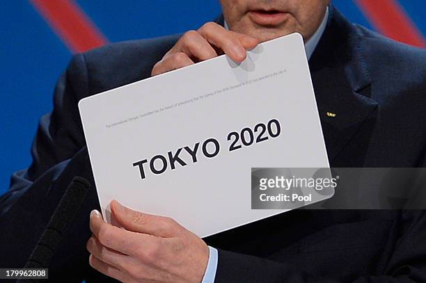 International Olympic Committee President Jacques Rogge shows the name of the city of Tokyo elected to host the 2020 Summer Olympics during a session...
