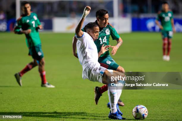 Rigoberto Rivas of Honduras battles for possession with Erick Sanchez of Mexico during the CONCACAF Nations League quarterfinals first leg match...