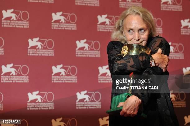 Italian actress Elena Cotta poses with the Coppa Volpi for the Best Actress she received for the movie "Via Castellana Bandiera" during a photocall...