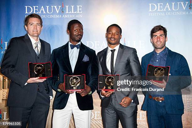 Tishuan Scott, Chris Eska, Ryan Coogler and Sam Fleischner pose with their prize at the award photocall during the 39th Deauville American Film...