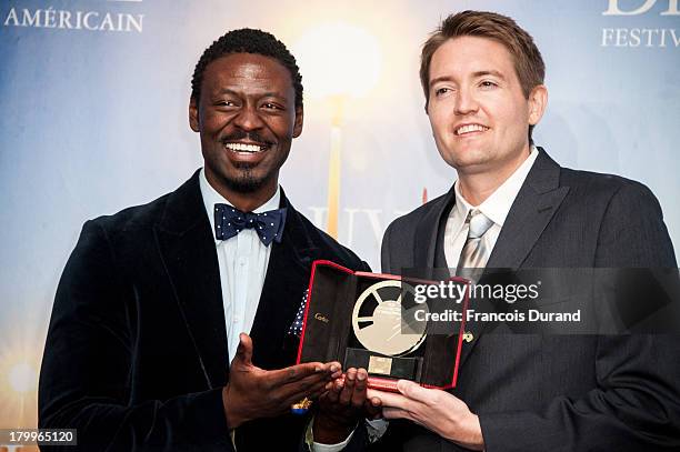 Tishuan Scott and Chris Eska pose with their prize for the film "The retrieval" during the 39th Deauville American Film Festival on September 7, 2013...