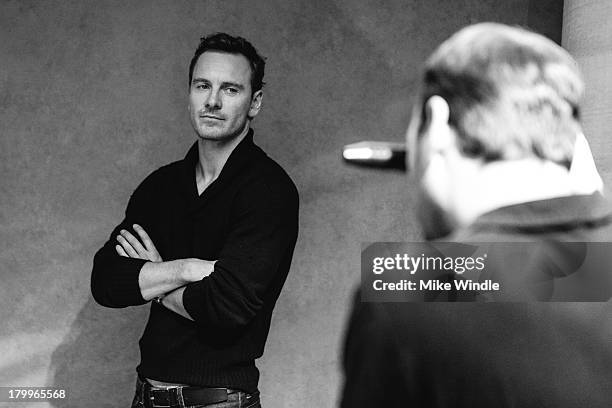 Actor Michael Fassbender poses for a portrait with photographer Jeff Vespa during the 2013 Toronto International Film Festival on September 7, 2013...