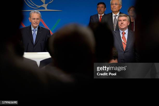 International Olympic Committee presidency candidate German Thomas Bach and International Olympic Committee President Jacques Rogge during the...
