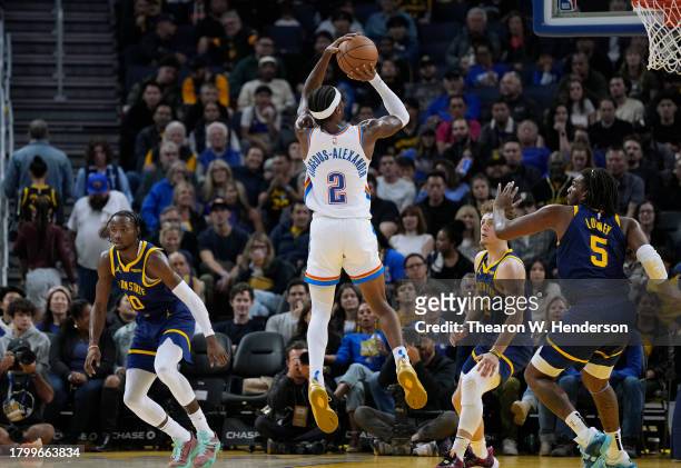 Shai Gilgeous-Alexander of the Oklahoma City Thunder shoots against the Golden State Warriors during the fourth quarter of an NBA basketball game at...