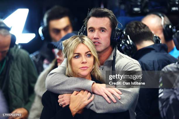 Rob McElhenney and Kaitlin Olson look on from the Alpine F1 garage during final practice ahead of the F1 Grand Prix of Las Vegas at Las Vegas Strip...