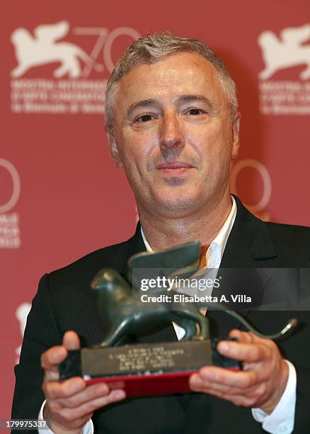 Director Robin Campillo poses on stage with the Orizzonti Award for Best Film he received for his movie 'Eastern Boys' as he attends the Award...