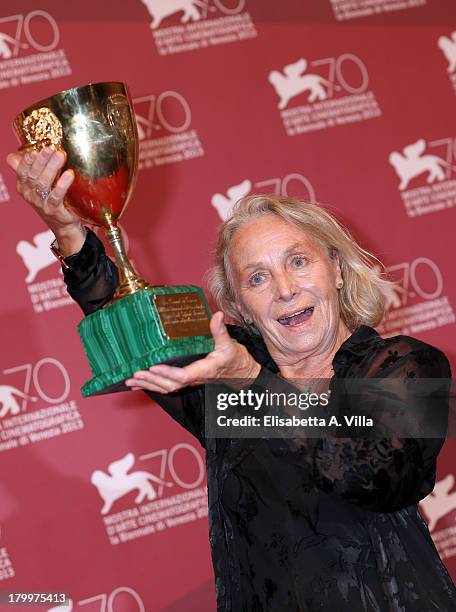 Actress Elena Cotta poses with the Best Actress Award she received for her role in the movie 'Via Castellana Bandiera' as she attends the Award...