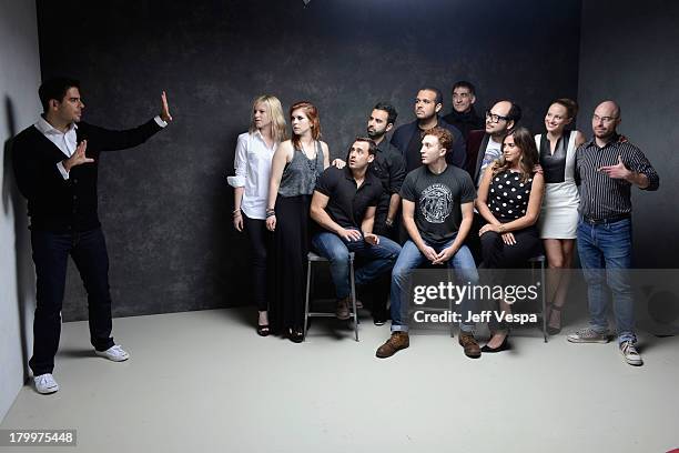 Director Eli Roth with the cast and crew of 'The Green Inferno' pose at the Guess Portrait Studio during 2013 Toronto International Film Festival on...