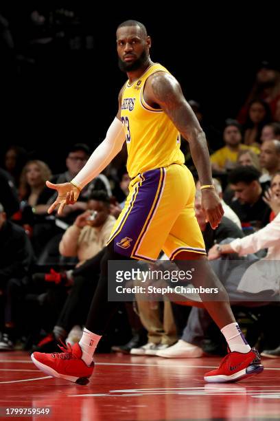 LeBron James of the Los Angeles Lakers reacts after a three point basket against the Portland Trail Blazers during the third quarter at Moda Center...