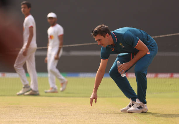 Pat Cummins of Australia inspects the pitch prior to an Australian press conference ahead of the the ICC Men's Cricket World Cup Final 2023 at...