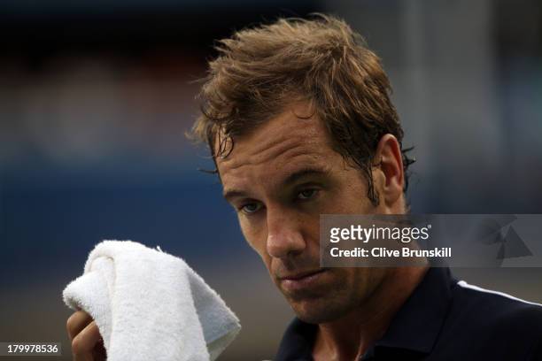 Richard Gasquet of France reacts during his men's singles semifinal match against Rafael Nadal of Spain on Day Thirteen of the 2013 US Open at USTA...