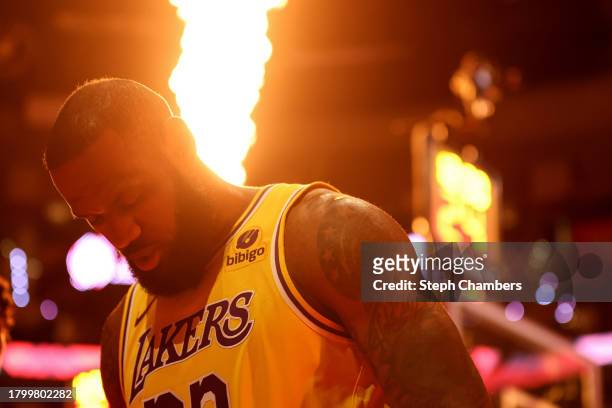 Flames illuminate LeBron James of the Los Angeles Lakers before the game against the Portland Trail Blazers at Moda Center on November 17, 2023 in...