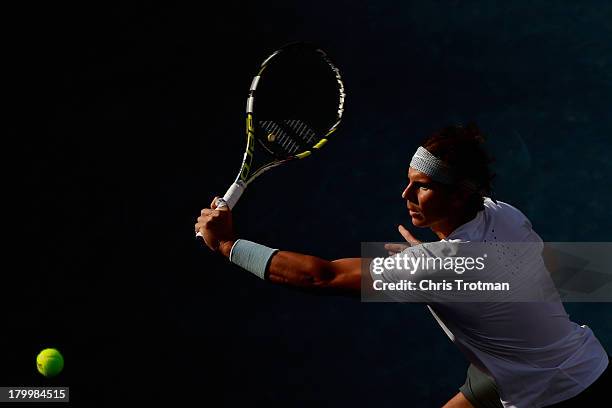 Rafael Nadal of Spain returns a shot against Richard Gasquet of France on Day Thirteen of the 2013 US Open at the USTA Billie Jean King National...