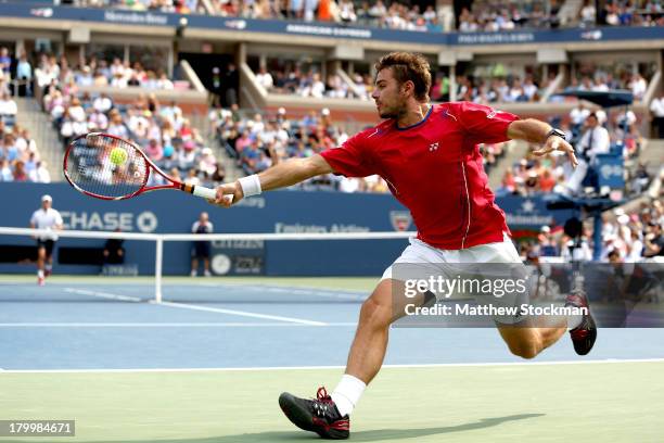 Stanislas Wawrinka of Switzerland returns a backhand during his men's singles semifinal match against Novak Djokovic of Serbia on Day Thirteen of the...