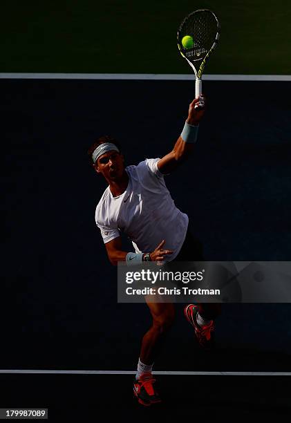 Rafael Nadal of Spain smashes the ball during his men's singles semifinal match against Richard Gasquet of France on Day Thirteen of the 2013 US Open...