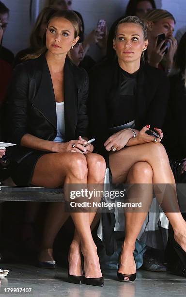 Stacy Keibler and actress Molly Sims attend the Monique Lhuillier fashion show during Mercedes-Benz Fashion Week Spring 2014 at The Theatre at...