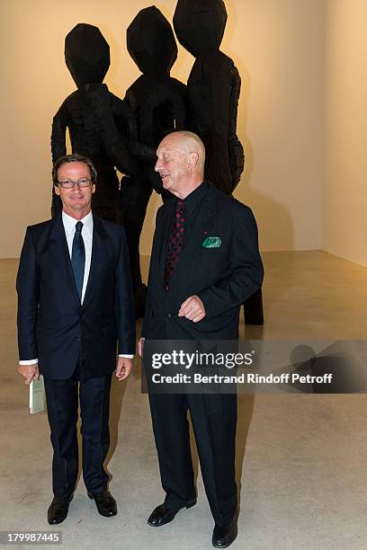 Artist Georg Baselitz and galerist Thaddaeus Ropac pose in front of Baselitz' monumental bronze sculpture "BDM Gruppe" during the Georg Baselitz...