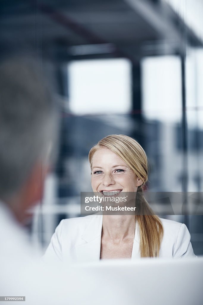 Smiling businesswoman in a office meeting