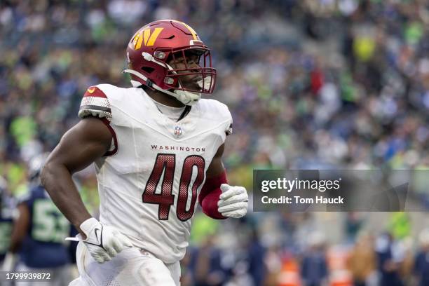 Alex Armah of the Washington Commanders runs on the field against the Seattle Seahawks at Lumen Field on November 12, 2023 in Seattle, Washington.