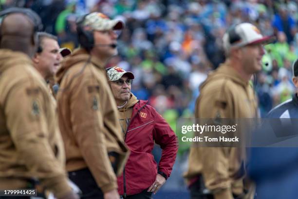 Ron Rivera of the Washington Commanders stand on the field against the Seattle Seahawk sat Lumen Field on November 12, 2023 in Seattle, Washington.