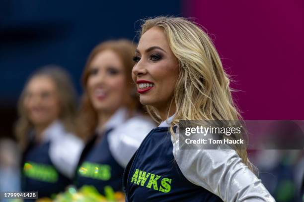 Cheerleaders of the Seattle Seahawks cheer during a game against the Washington Commanders at Lumen Field on November 12, 2023 in Seattle, Washington.