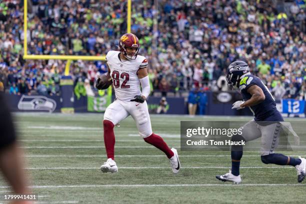 Logan Thomas of the Washington Commanders runs on the field against the Seattle Seahawks at Lumen Field on November 12, 2023 in Seattle, Washington.