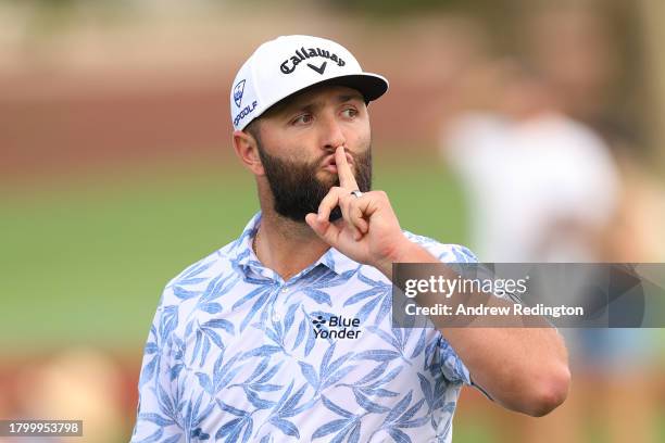 Jon Rahm of Spain gestures with his hand to his mouth on course during Day Three of the DP World Tour Championship on the Earth Course at Jumeirah...