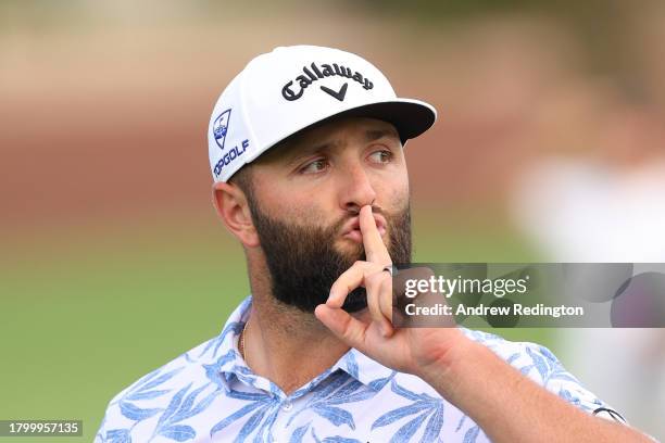 Jon Rahm of Spain gestures with his hand to his mouth on course during Day Three of the DP World Tour Championship on the Earth Course at Jumeirah...