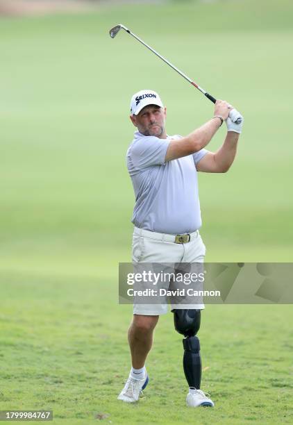 Mike Browne of England plays his fourth shot on the 18th hole during the G4D Tour @ DP World Tour Championship on Day Three of the DP World Tour...