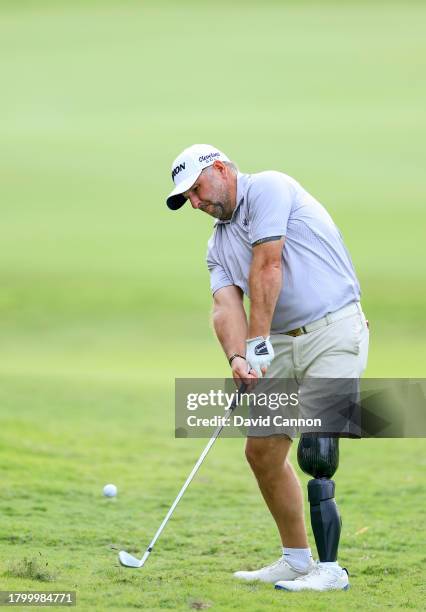 Mike Browne of England plays his fourth shot on the 18th hole during the G4D Tour @ DP World Tour Championship on Day Three of the DP World Tour...