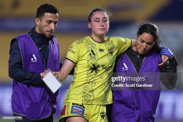 Hope Breslin of the Phoenix leaves the field following a collision during the A-League Women round five match between Central Coast Mariners and...