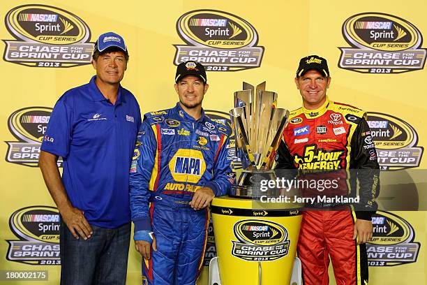 Team owner Michael Waltrip poses with his drivers Martin Truex Jr., driver of the NAPA Auto Parts Toyota, and Clint Bowyer, driver of the 5-hour...