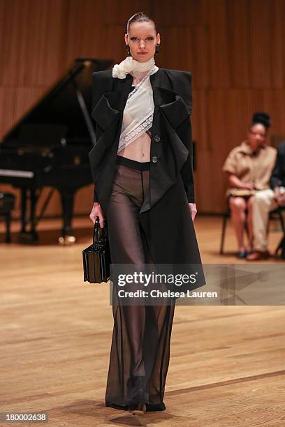 Model walks the runway at the Sukeina fashion show during Mercedes-Benz Fashion Week Spring 2014 at the DiMenna Center on September 7, 2013 in New...