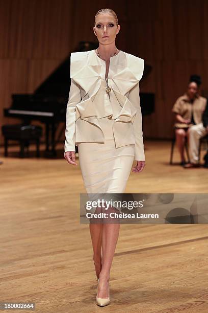 Model walks the runway at the Sukeina fashion show during Mercedes-Benz Fashion Week Spring 2014 at the DiMenna Center on September 7, 2013 in New...