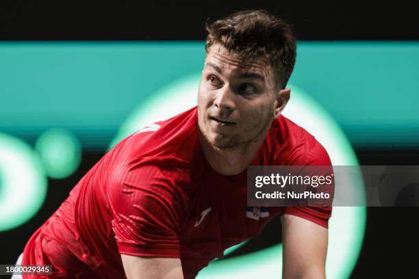 Miomir Kecmanovic of Serbia is playing in the quarterfinal match against Jack Draper of Great Britain at the Davis Cup at Martin Carpena in Malaga,...