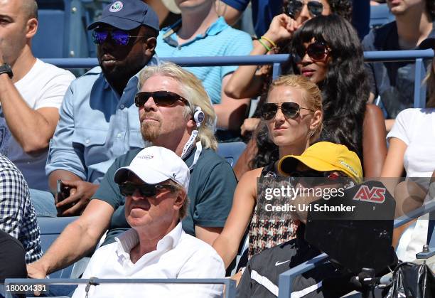 Sir Richard Branson and Jelena Ristic attend the 2013 US Open at USTA Billie Jean King National Tennis Center on September 7, 2013 in New York City.