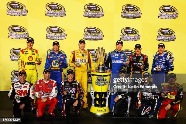 Joey Logano, driver of the Shell Pennzoil Ford, Martin Truex Jr., driver of the NAPA Auto Parts Toyota, Kyle Busch, driver of the M&M's American...