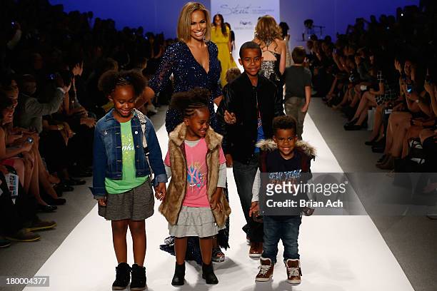 Amber Sabathia walks the runway with her children, Carsten, Jaden, Cyia and Carter at Strut: The Fashionable Mom Show during Mercedes-Benz Fashion...
