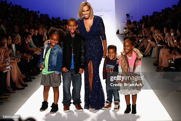 Amber Sabathia walks the runway with her children, Carsten, Jaden, Cyia and Carter at Strut: The Fashionable Mom Show during Mercedes-Benz Fashion...