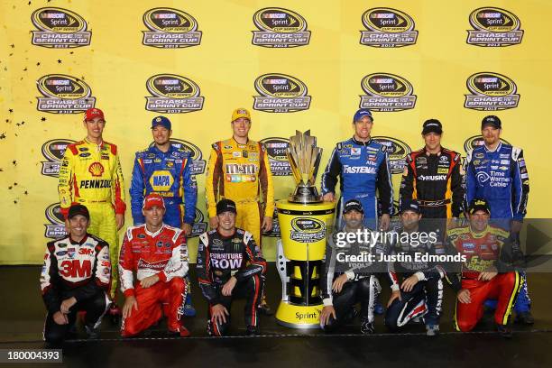 Joey Logano, driver of the Shell Pennzoil Ford, Martin Truex Jr., driver of the NAPA Auto Parts Toyota, Kyle Busch, driver of the M&M's American...