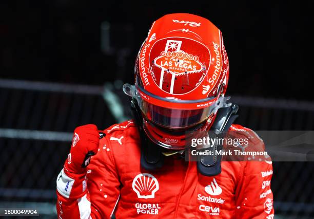 Pole position qualifier Charles Leclerc of Monaco and Ferrari celebrates in parc ferme during qualifying ahead of the F1 Grand Prix of Las Vegas at...