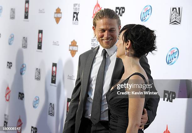 Actors Charlie Hunnam and Maggie Siff attend the season 6 premiere of FX's "Sons Of Anarchy" at Dolby Theatre on September 7, 2013 in Hollywood,...