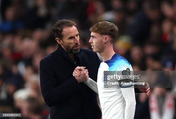 England Manager Gareth Southgate speaks with Cole Palmer as he prepares to come on for his England debut during the UEFA EURO 2024 European qualifier...