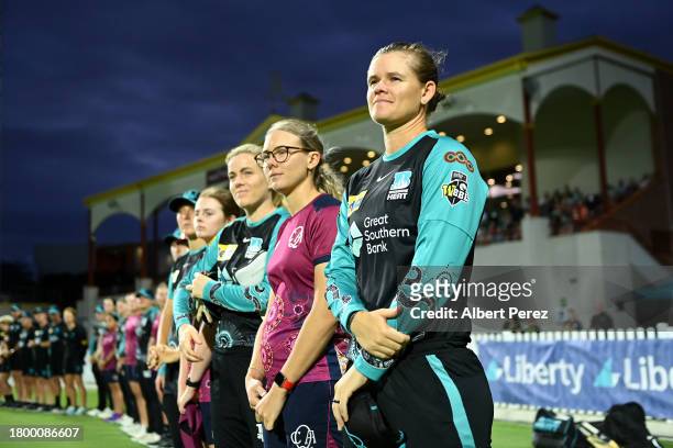 Jessica Jonassen of the Heat and team mates observe a cultural performance before the WBBL match between Brisbane Heat and Melbourne Renegades at...