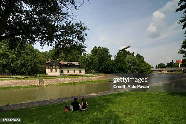 couple sitting on the grass, danube canal raba - gyor stock pictures, royalty-free photos & images