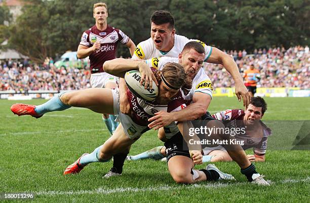 David Williams of the Sea Eagles scores a try during the round 26 NRL match between the Manly Warringah Sea Eagles and the Penrith Panthers at...