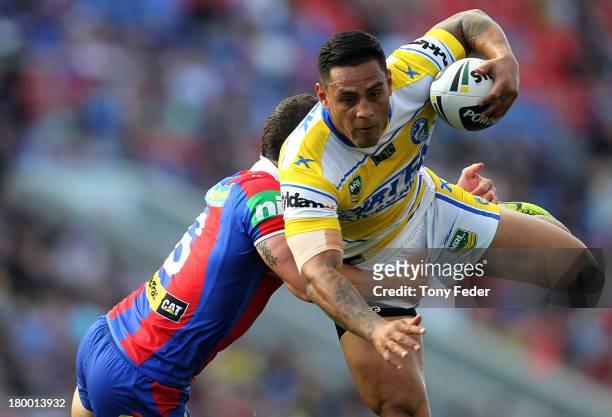 Reni Maitua of the Eels is tackled during the round 26 NRL match between the Newcastle Knights and the Parramatta Eels at Hunter Stadium on September...