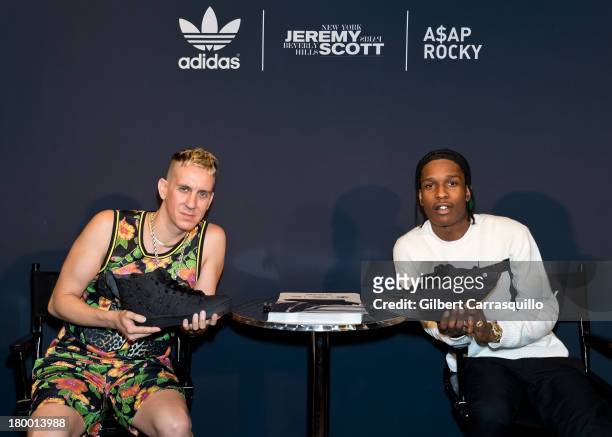 Designer Jeremy Scott and rapper A$AP Rocky attend the Jeremy Scott x A$AP Rocky Wings 2.0 - Black Flag - shoe launch at Adidas Originals Store on...